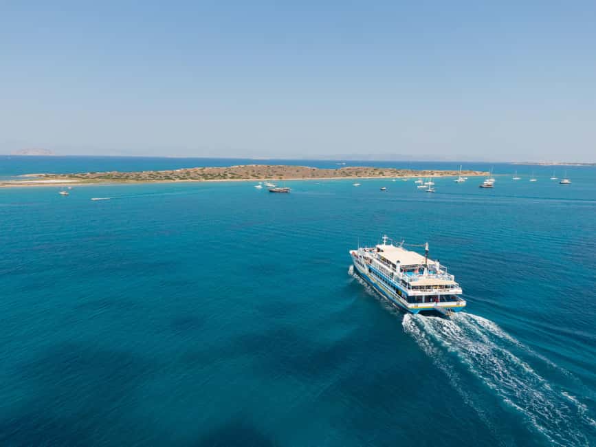 Athens: Islands Swimming Day Cruise. DJ, Lunch & Drinks inc. - Aegina harbour time: pistachios, neoclassical facades, and a temple view if you want it