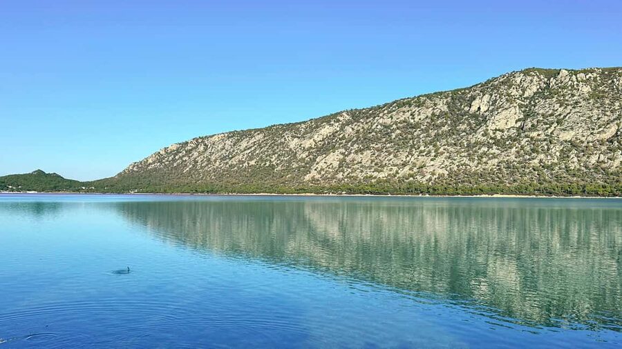 Athens: Lake Vouliagmeni Corinthia, Heraion Sunset & Swim - Lake Vouliagmeni: pine forests, crystal water, and a real swim break