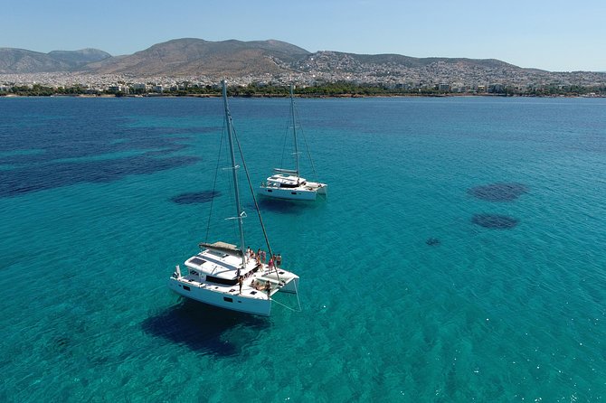 Athens Private Luxury Catamaran Cruise with Traditional Greek Meal and BBQ - Welcome aboard: safety briefing and that first drink