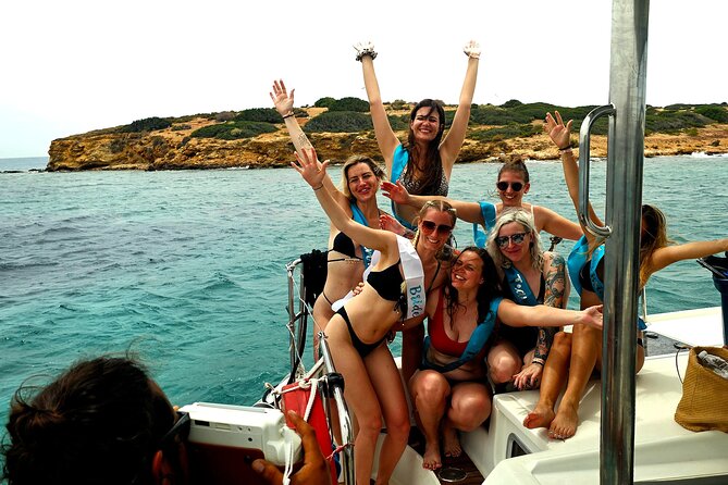 Athens Riviera Catamaran tour with fresh Meal Drinks and Swimming - Swim stop #1: Vouliagmeni Bay and that first taste of clear water