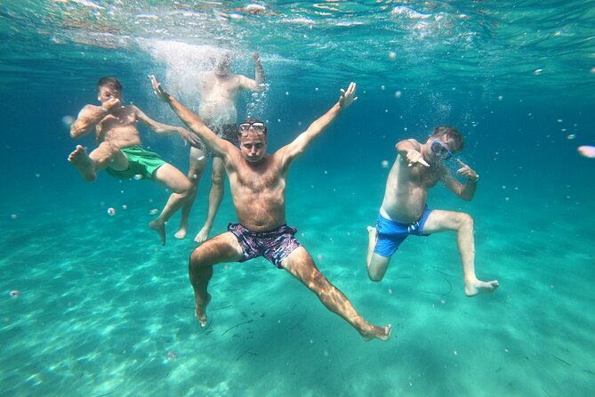 Sail the Athenian Coastline on a Catamaran with Meal & Wine - Stop 2: Vouliagmeni Bay for views, swimming, and watersports time